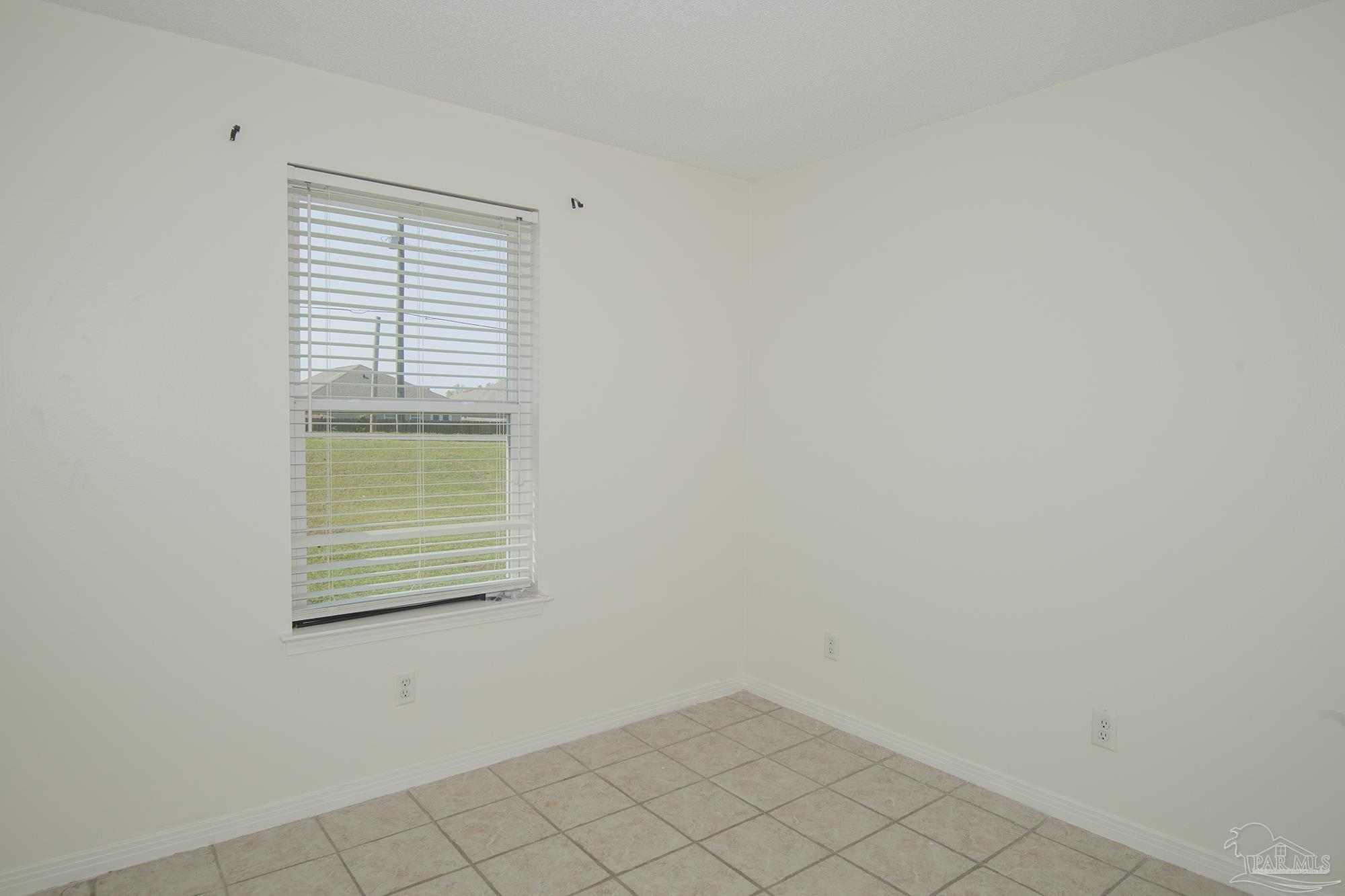 5578 Cyanamid Road Milton, FL 32583 - Photo 12 of 33 a view of an empty room with a window