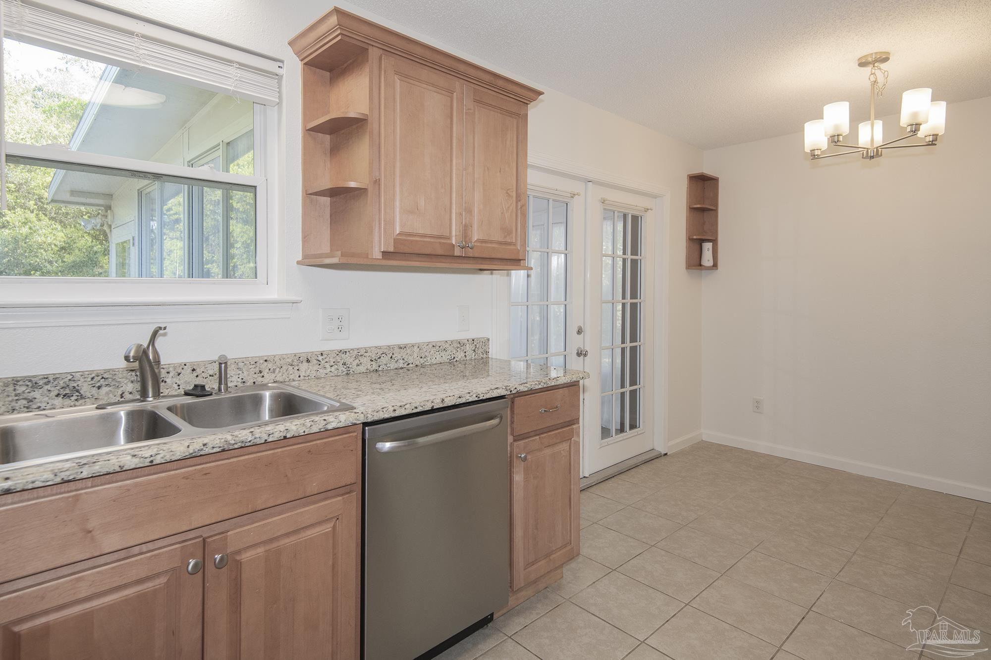 5578 Cyanamid Road Milton, FL 32583 - Photo 16 of 33 a kitchen with a sink and cabinets
