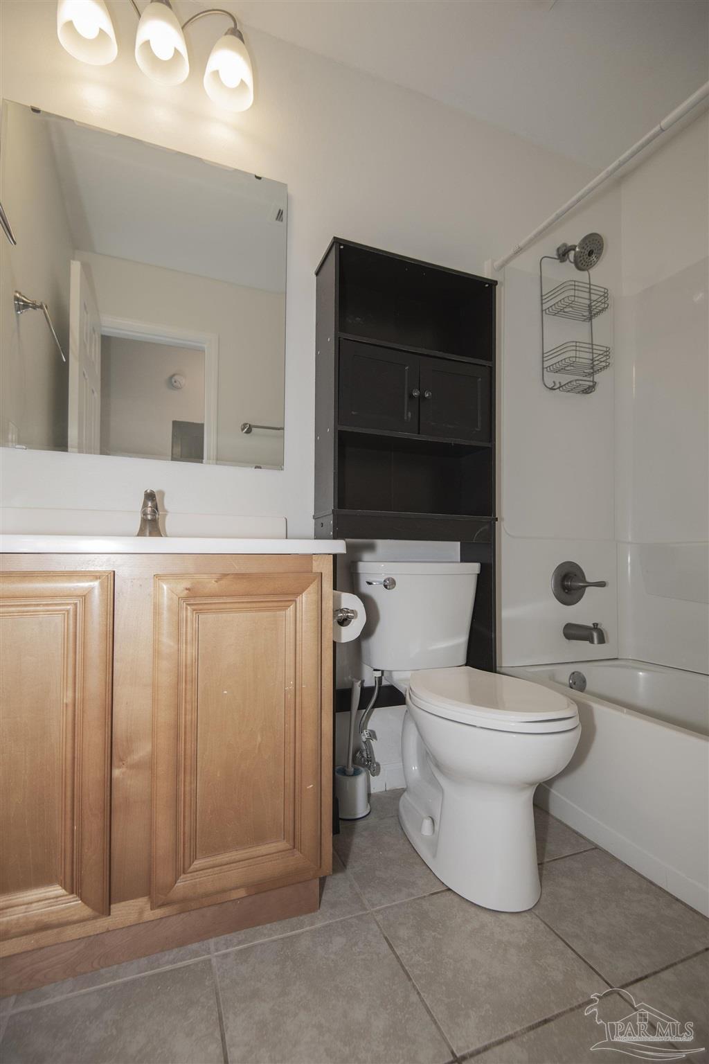 5578 Cyanamid Road Milton, FL 32583 - Photo 19 of 33 a bathroom with a sink a toilet and mirror