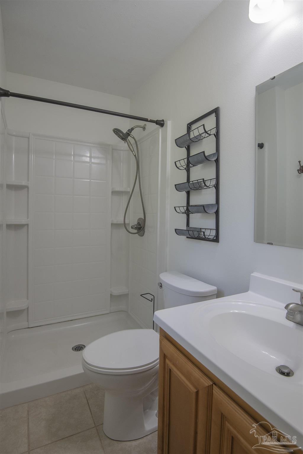 5578 Cyanamid Road Milton, FL 32583 - Photo 24 of 33 a bathroom with a sink a toilet and shower