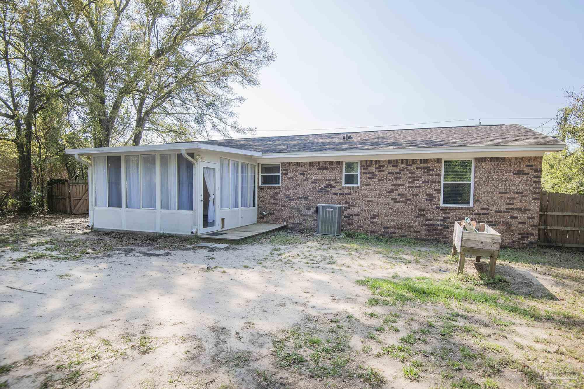 5578 Cyanamid Road Milton, FL 32583 - Photo 29 of 33 a view of house with backyard and furniture