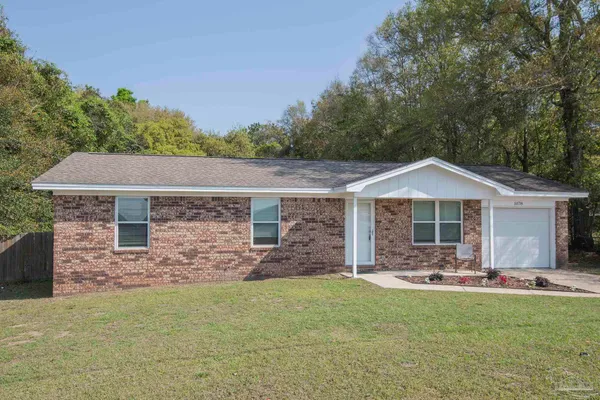 a front view of a house with yard