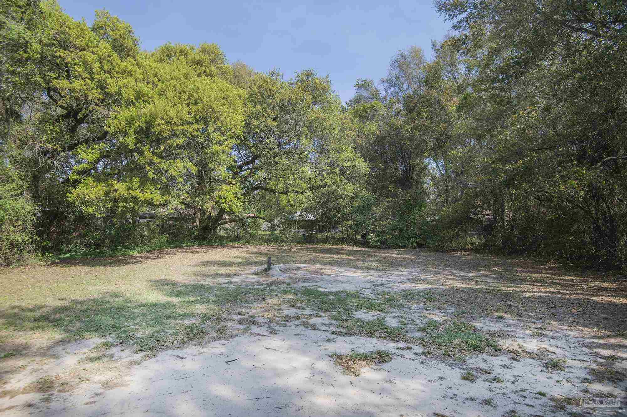 5578 Cyanamid Road Milton, FL 32583 - Photo 31 of 33 a view of dirt yard with a trees