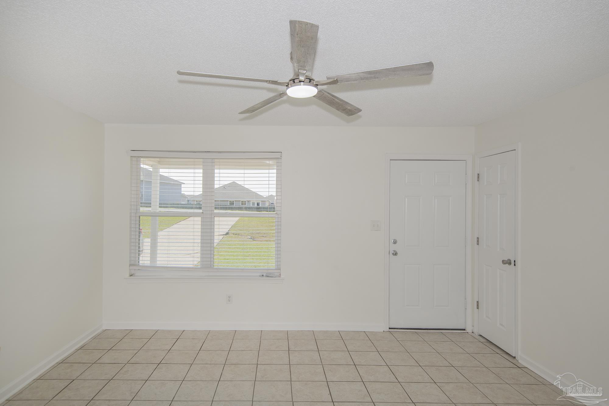 5578 Cyanamid Road Milton, FL 32583 - Photo 6 of 33 an empty room with windows and fan