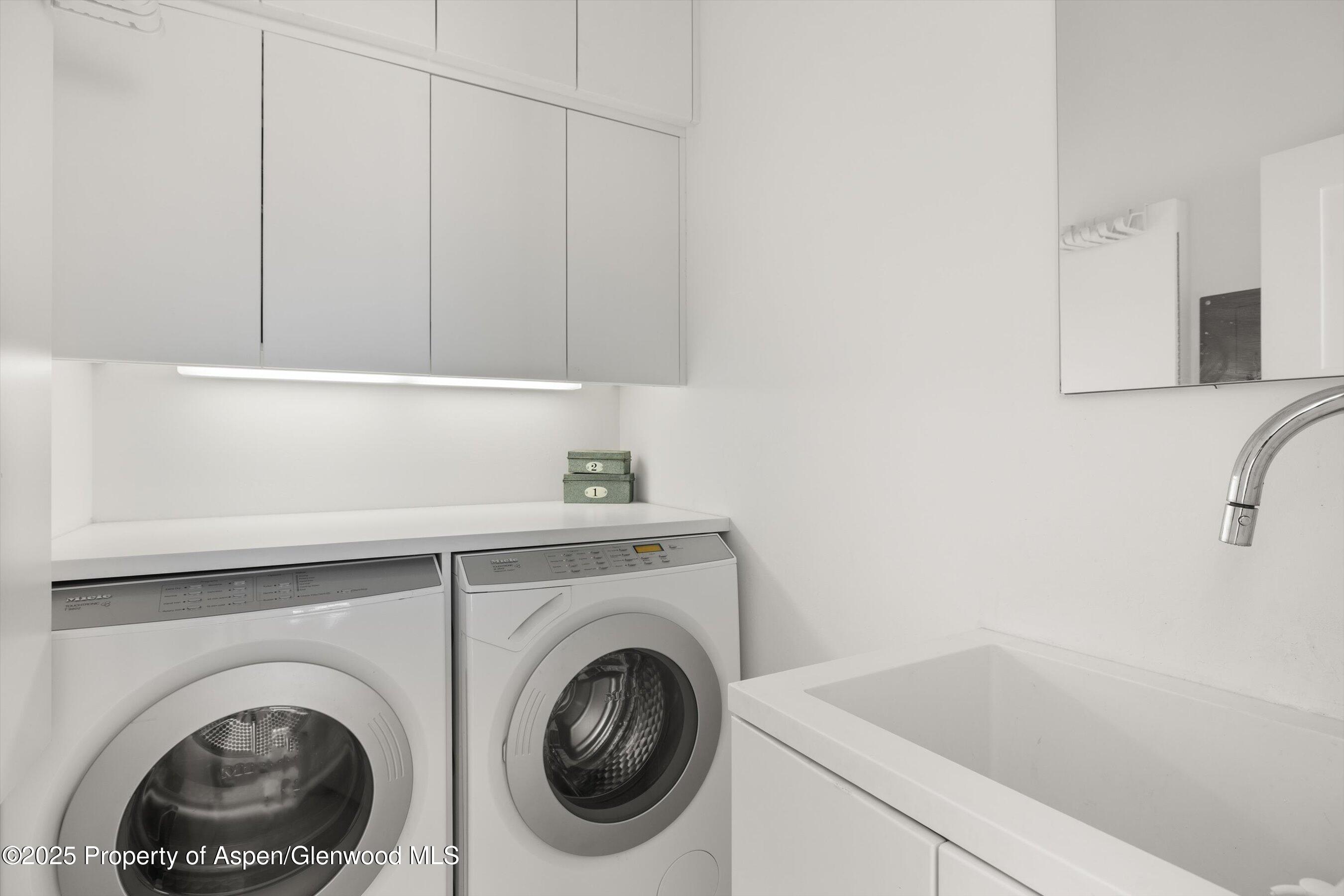 2103 Ten Peaks Mesa Road Carbondale, CO 81623 - Photo 29 of 52 a utility room with dryer and washer