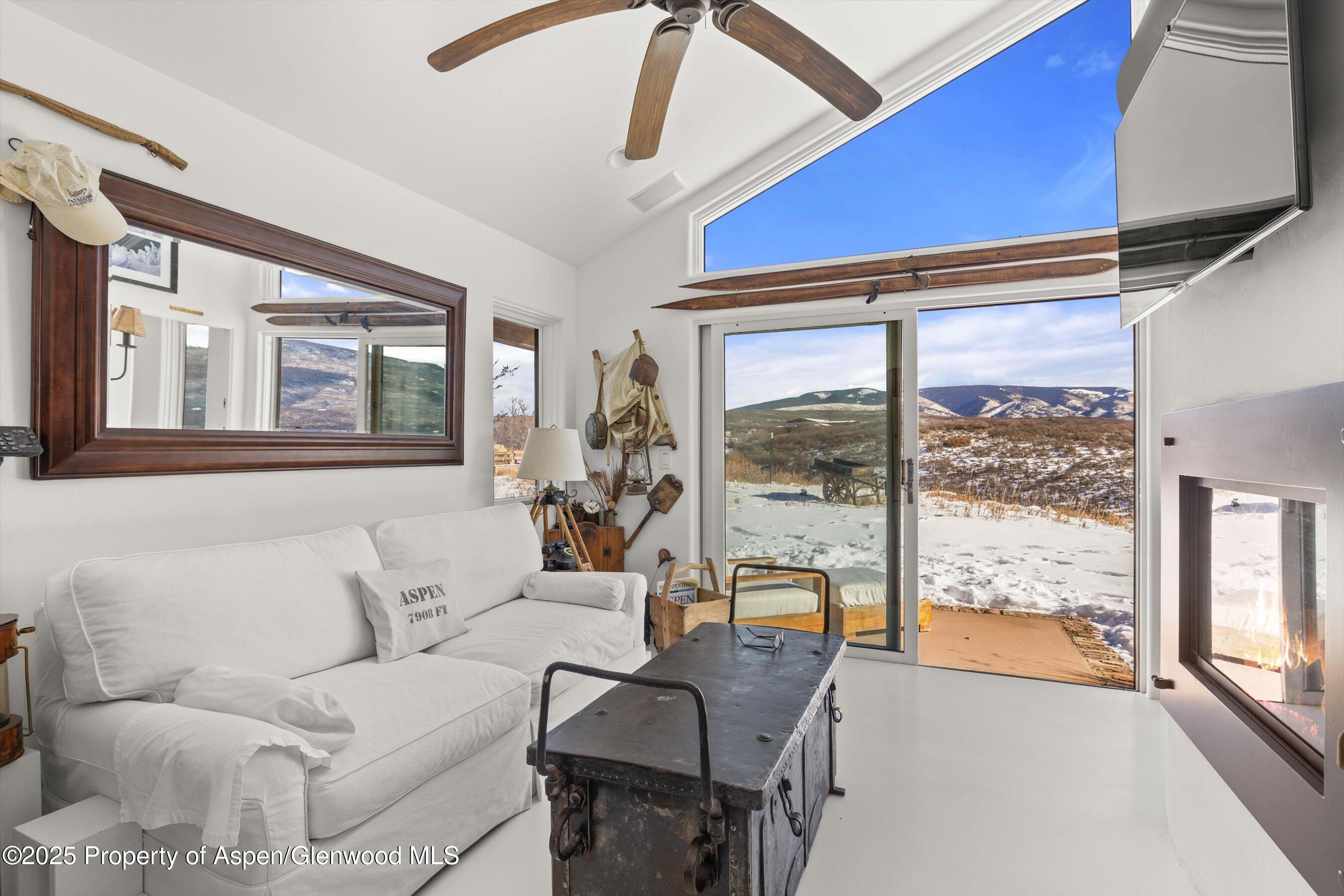 2103 Ten Peaks Mesa Road Carbondale, CO 81623 - Photo 30 of 52 a living room with furniture and a large window