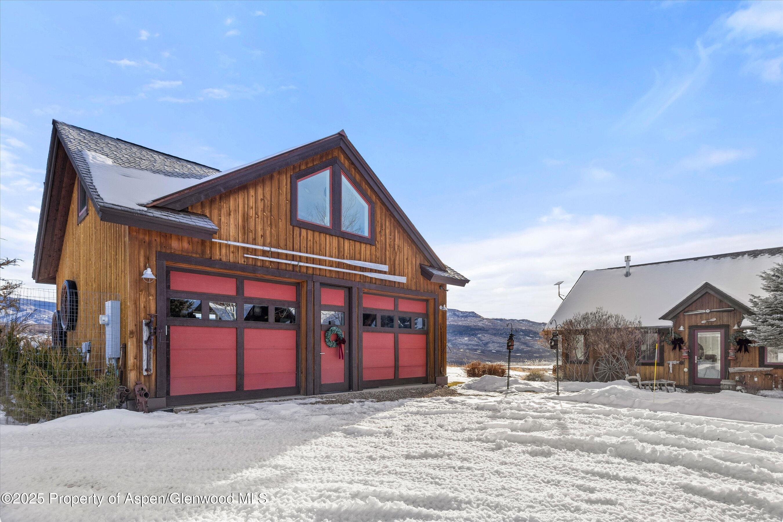 2103 Ten Peaks Mesa Road Carbondale, CO 81623 - Photo 40 of 52 a view of a house with a yard and garage