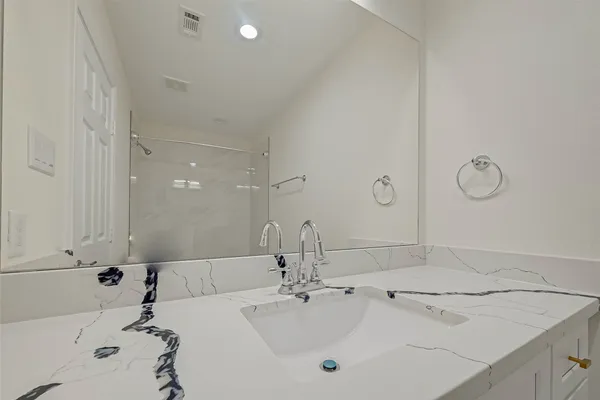 a bathroom with a sink and a bathtub
