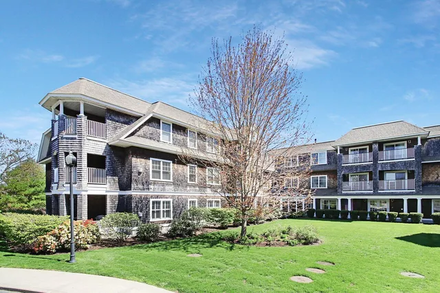 a front view of a building with garden