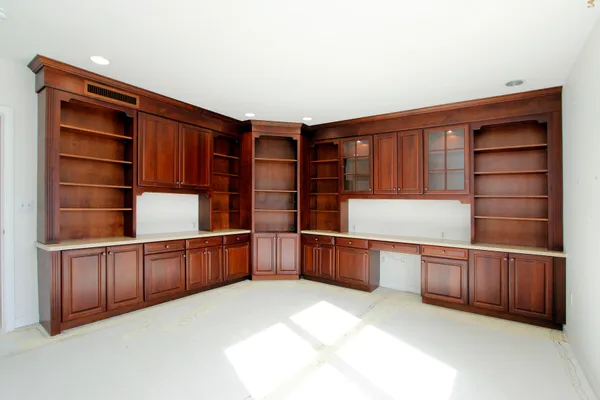 a kitchen with cabinets and window