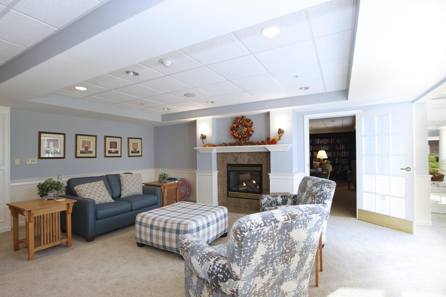 18 West Road, Unit 307 Orleans, MA 02653 - Photo 20 of 31 a living room with furniture and a fireplace