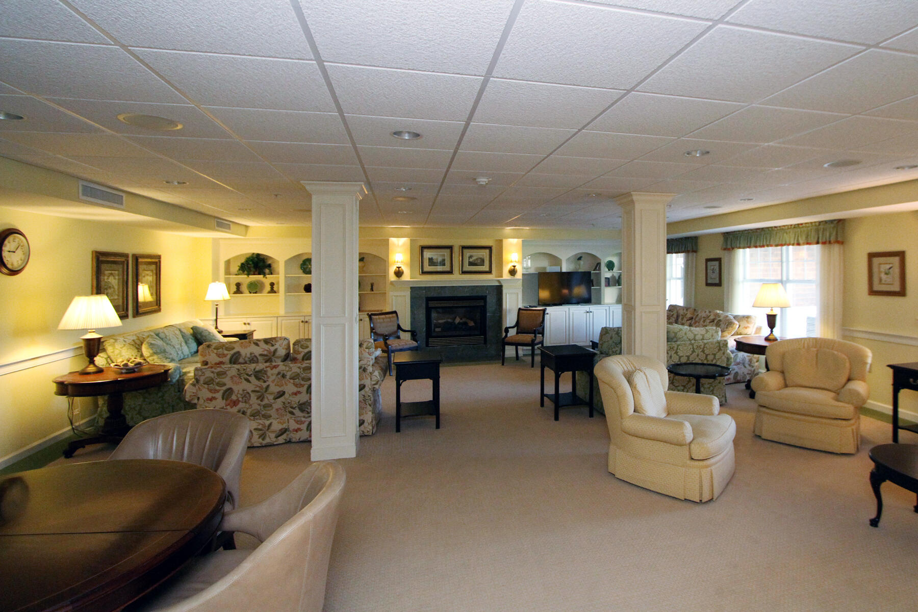 18 West Road, Unit 307 Orleans, MA 02653 - Photo 27 of 31 a living room with furniture and a fireplace