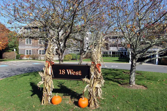 a view of a room with water heater and wooden walls