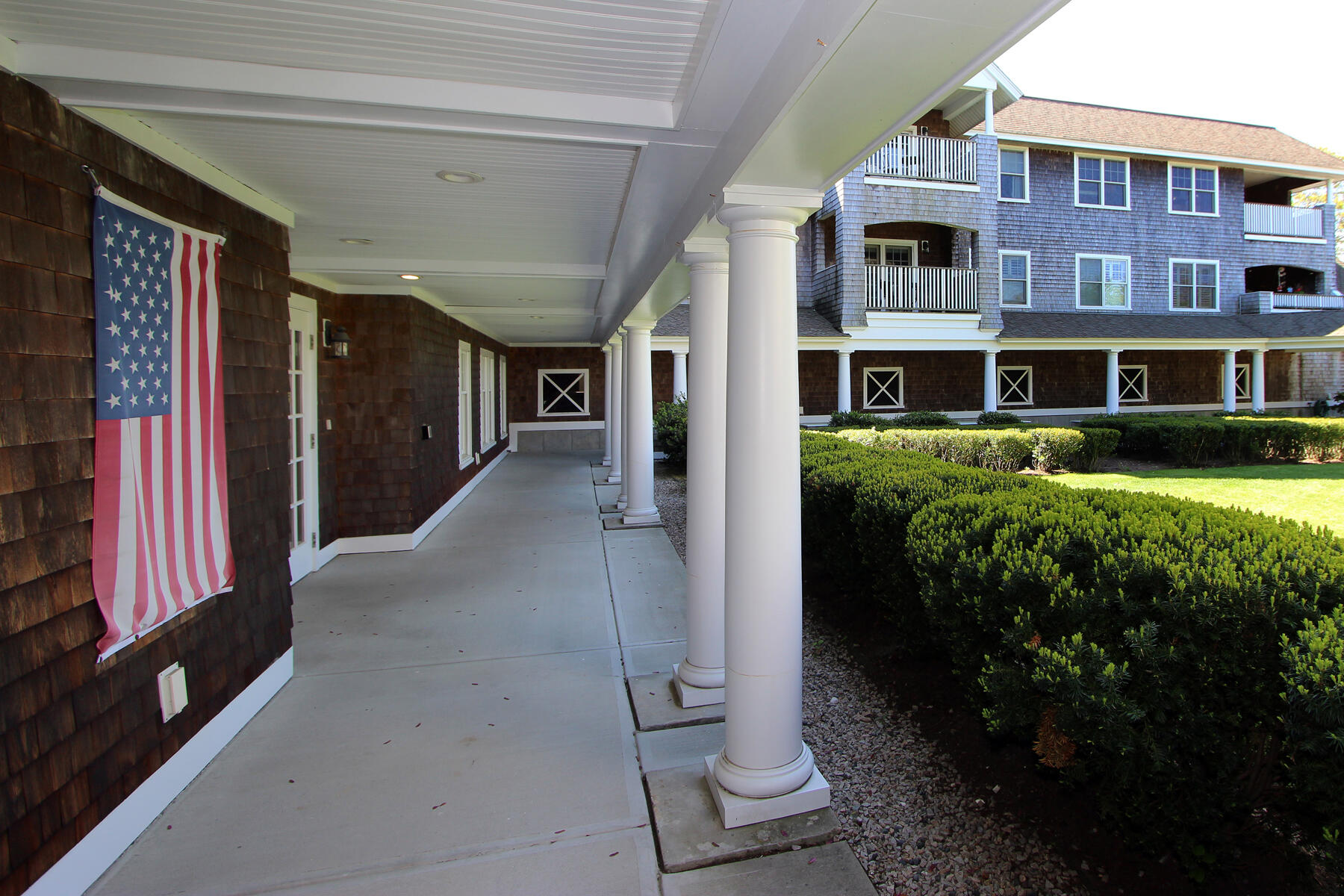 18 West Road, Unit 307 Orleans, MA 02653 - Photo 3 of 31 a view of a house with backyard porch and sitting area