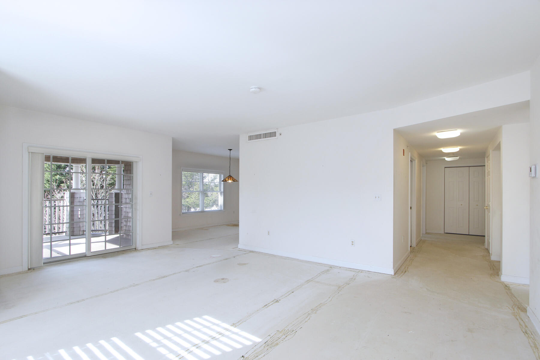 18 West Road, Unit 307 Orleans, MA 02653 - Photo 7 of 31 an empty room with windows and closet