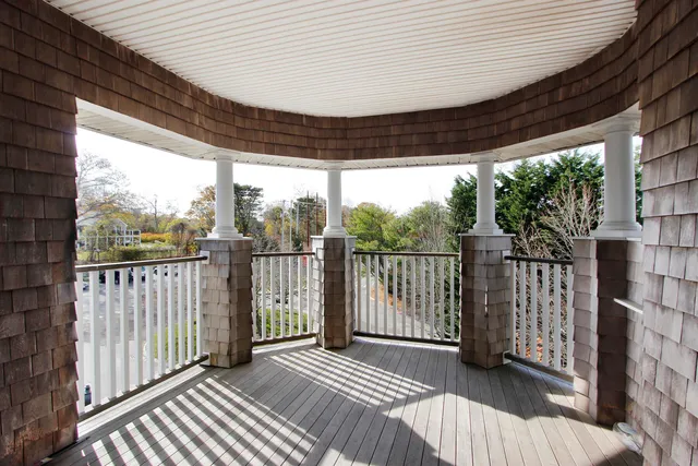a view of a porch with wooden floor