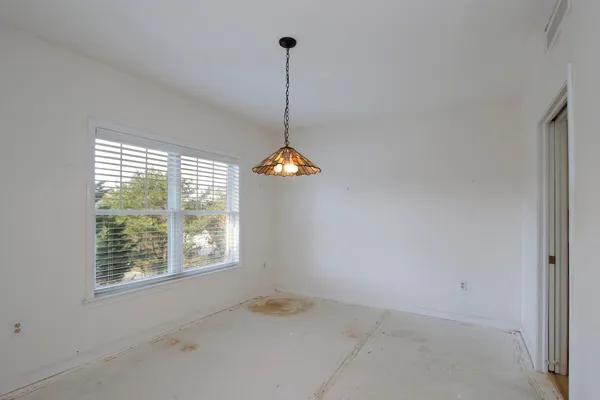 a view of a room with windows