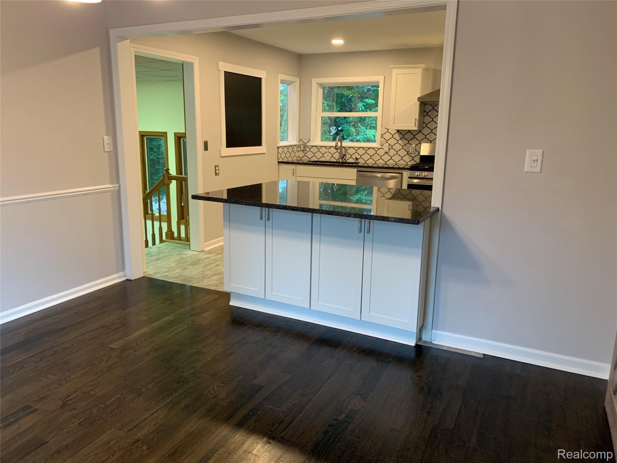 4859 Crooked Lake Road Howell, MI 48843 - Photo 10 of 90 Freshly Painted and Hardwood refinished in Dining room
