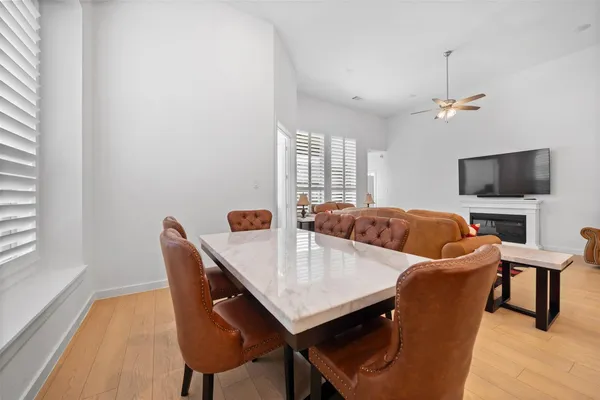 a view of a dining room with furniture and window