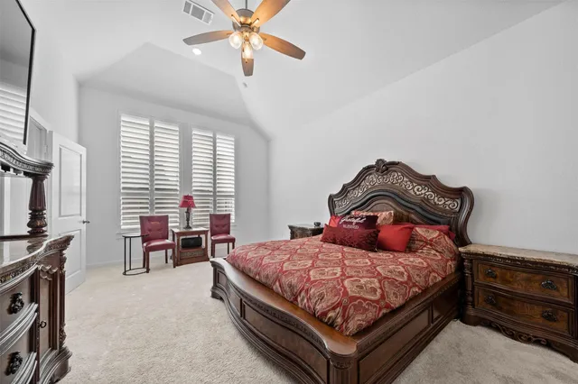 a bedroom with a bed and a cabinets