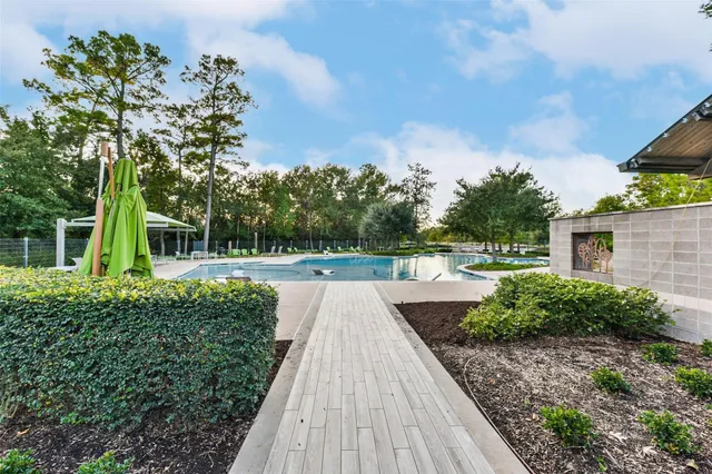 a view of swimming pool with a yard