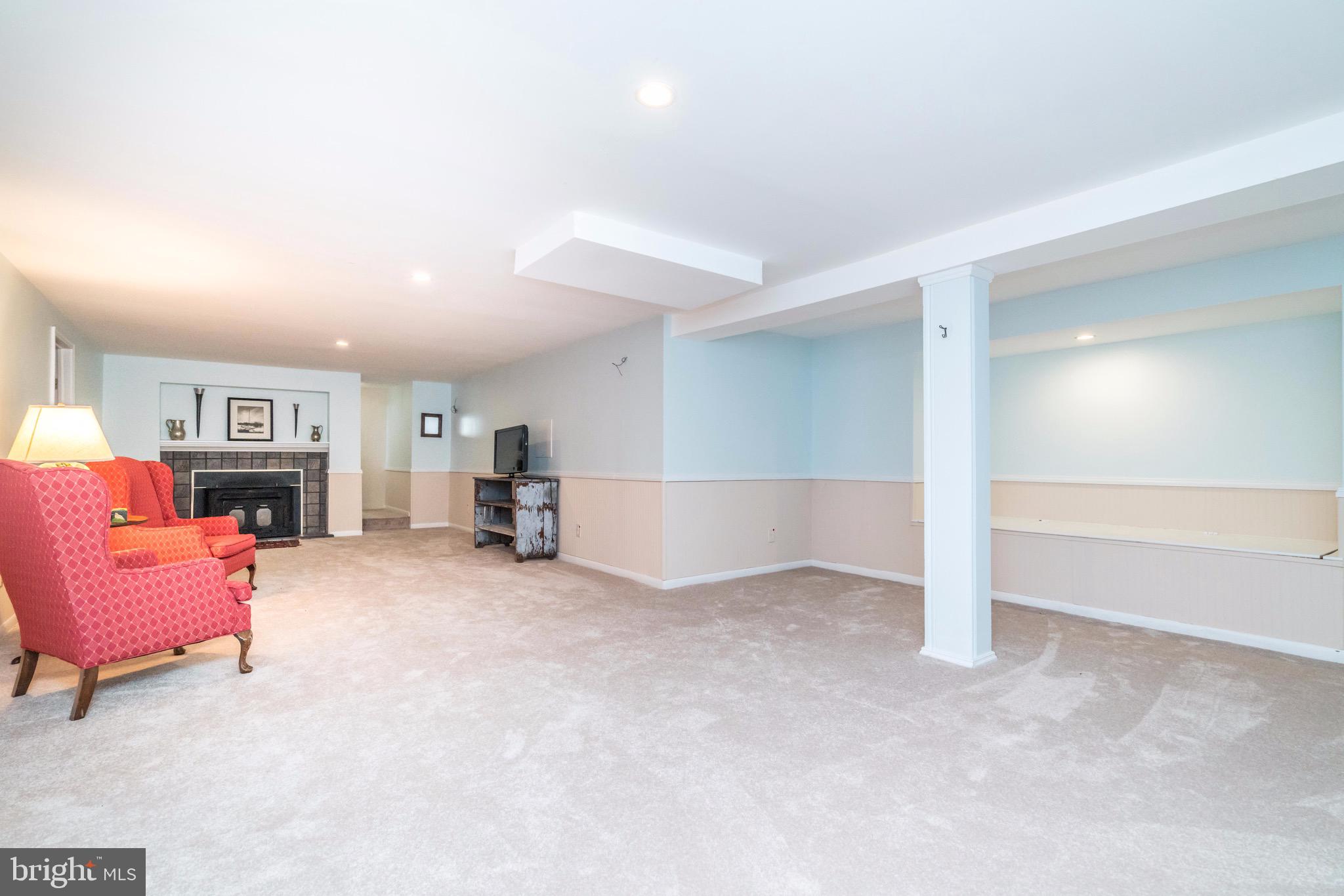 407 Range Road Towson, MD 21204 - Photo 23 of 28 lower level clubrm w/ fireplace