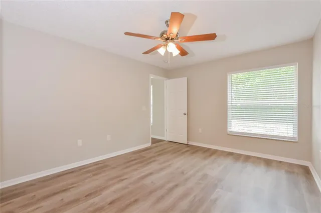 a bathroom with a sink a toilet and window