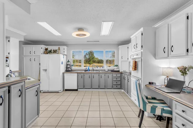 a kitchen with a cabinets and appliances