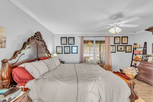 a bedroom with a large bed and a window