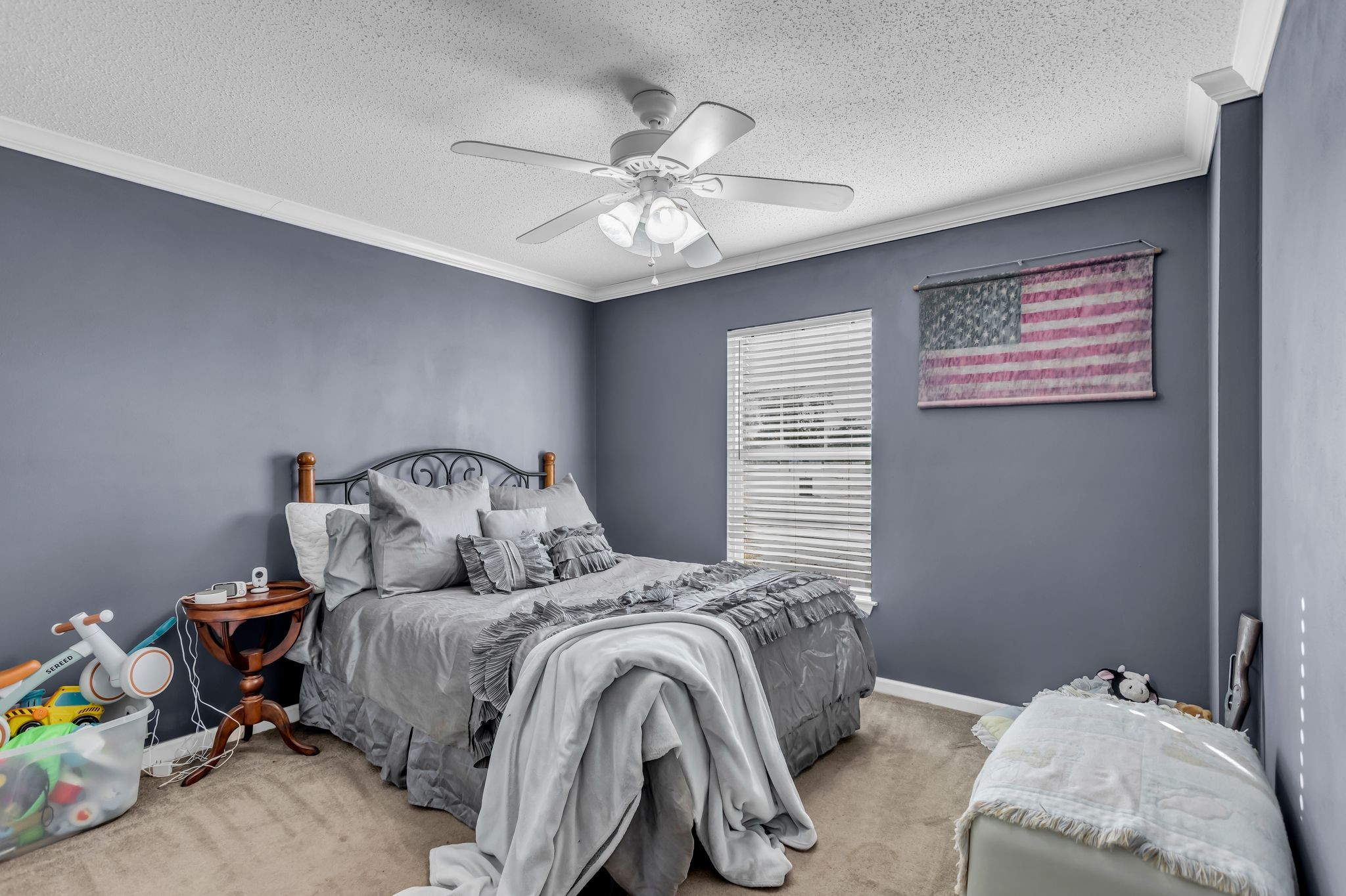 2673 McKnight Road Culleoka, TN 38451 - Photo 24 of 41 a bedroom with a bed and a chandelier