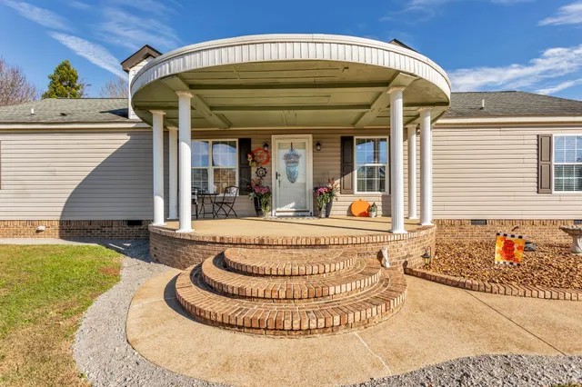 front view of a house with a swimming pool