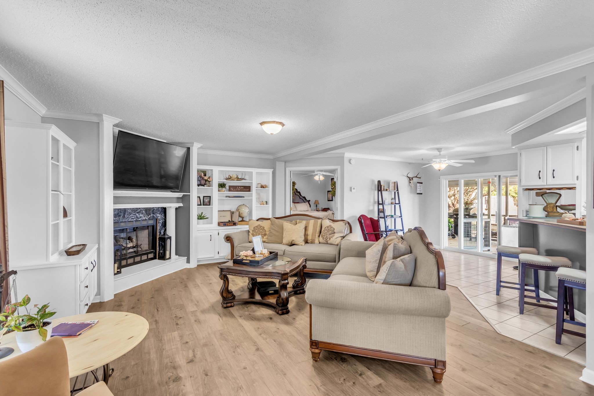2673 McKnight Road Culleoka, TN 38451 - Photo 8 of 41 a living room with furniture a fireplace and a flat screen tv