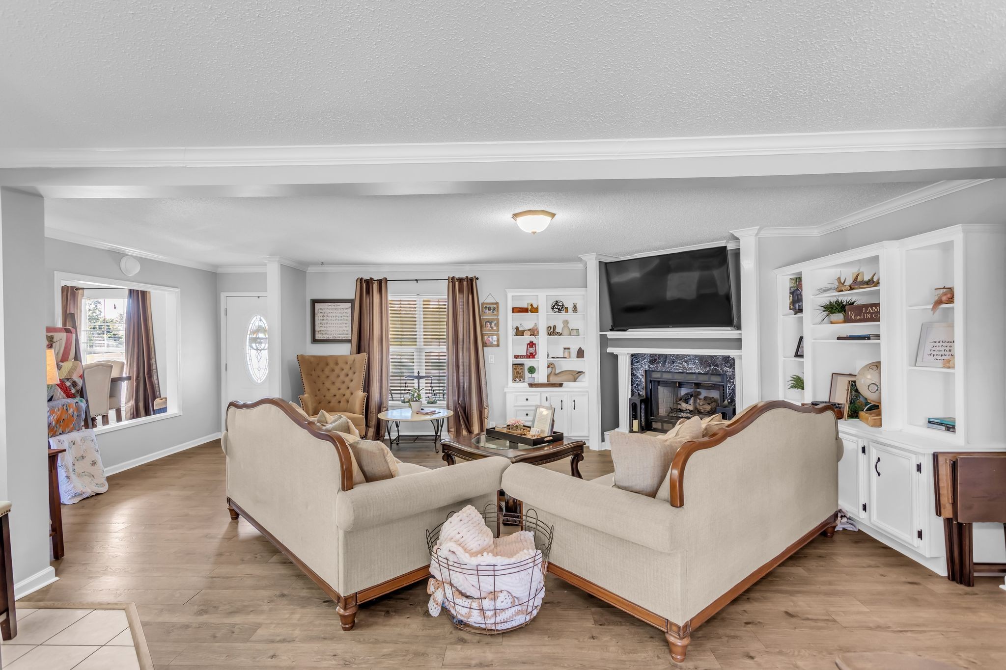 2673 McKnight Road Culleoka, TN 38451 - Photo 9 of 41 a living room with furniture a flat screen tv and a fireplace