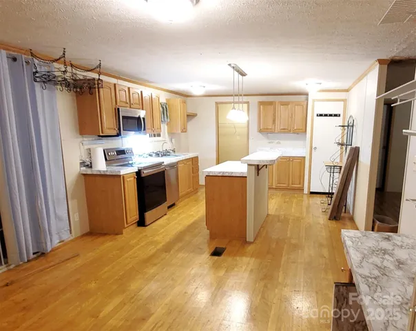a bed room with a bed furniture and a flat screen tv