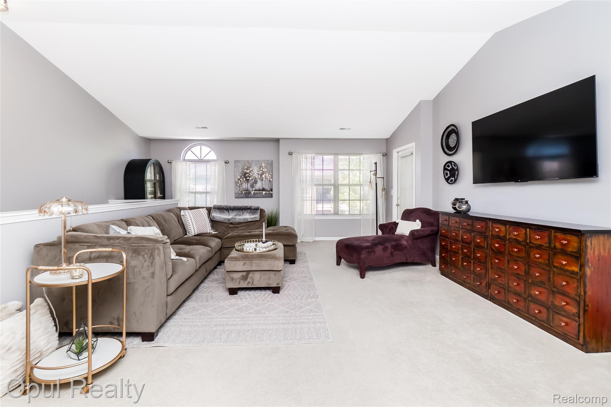 11762 Farmington Road Livonia, MI 48150 - Photo 3 of 25 Living area featuring light carpet and vaulted ceiling