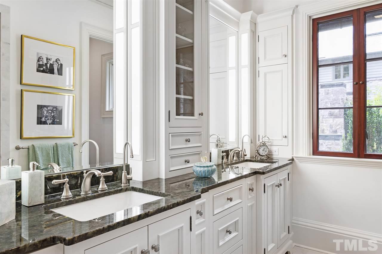 483 Rosemont Drive Durham, NC 27713 - Photo 12 of 88 a bathroom with double vanity sinks a mirror and a window