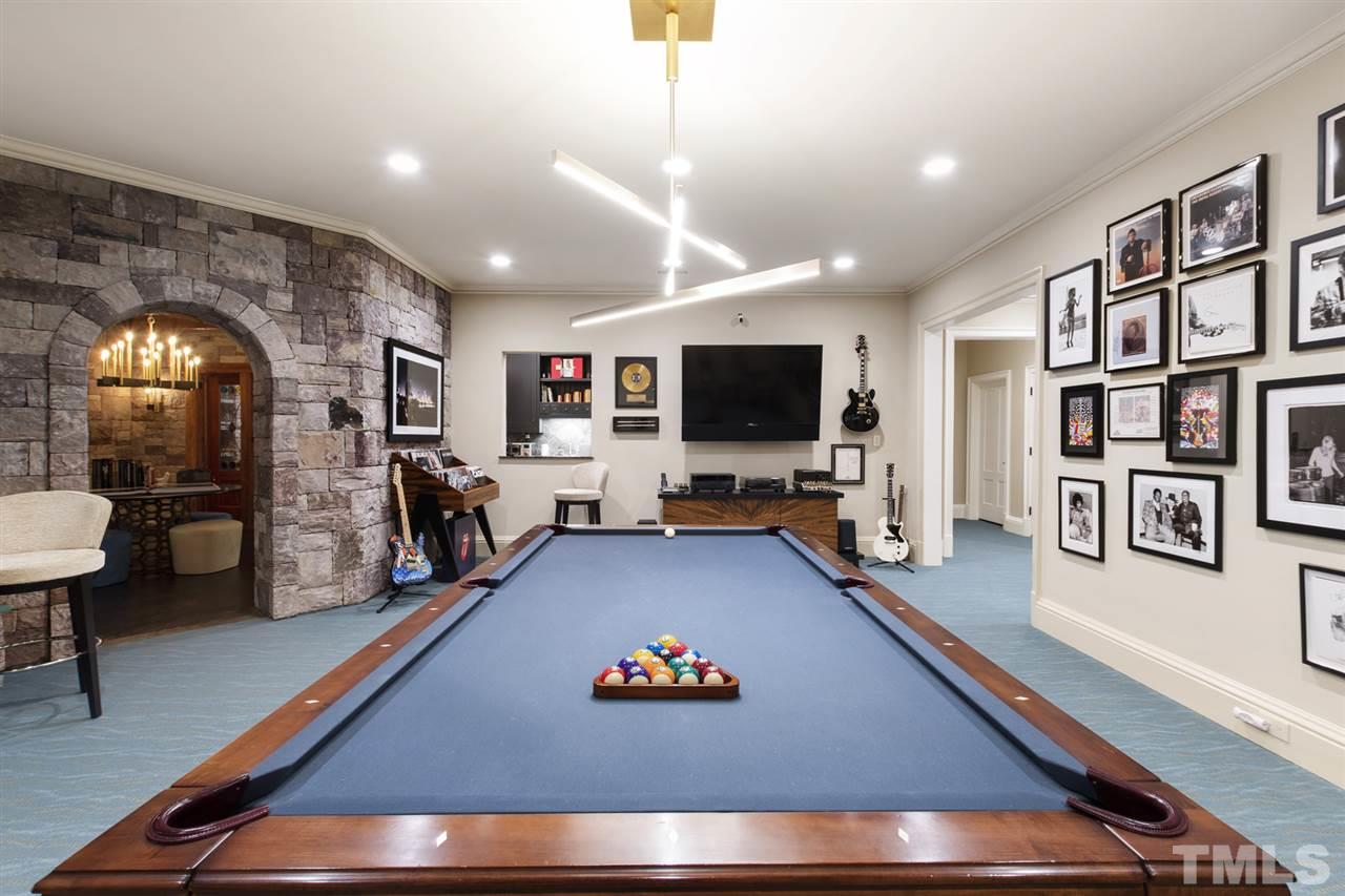 483 Rosemont Drive Durham, NC 27713 - Photo 19 of 88 a living room with furniture and a flat screen tv