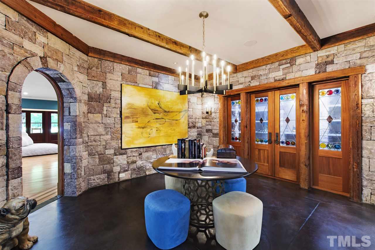 483 Rosemont Drive Durham, NC 27713 - Photo 20 of 88 a dining room with furniture wooden floor wooden floor and a chandelier