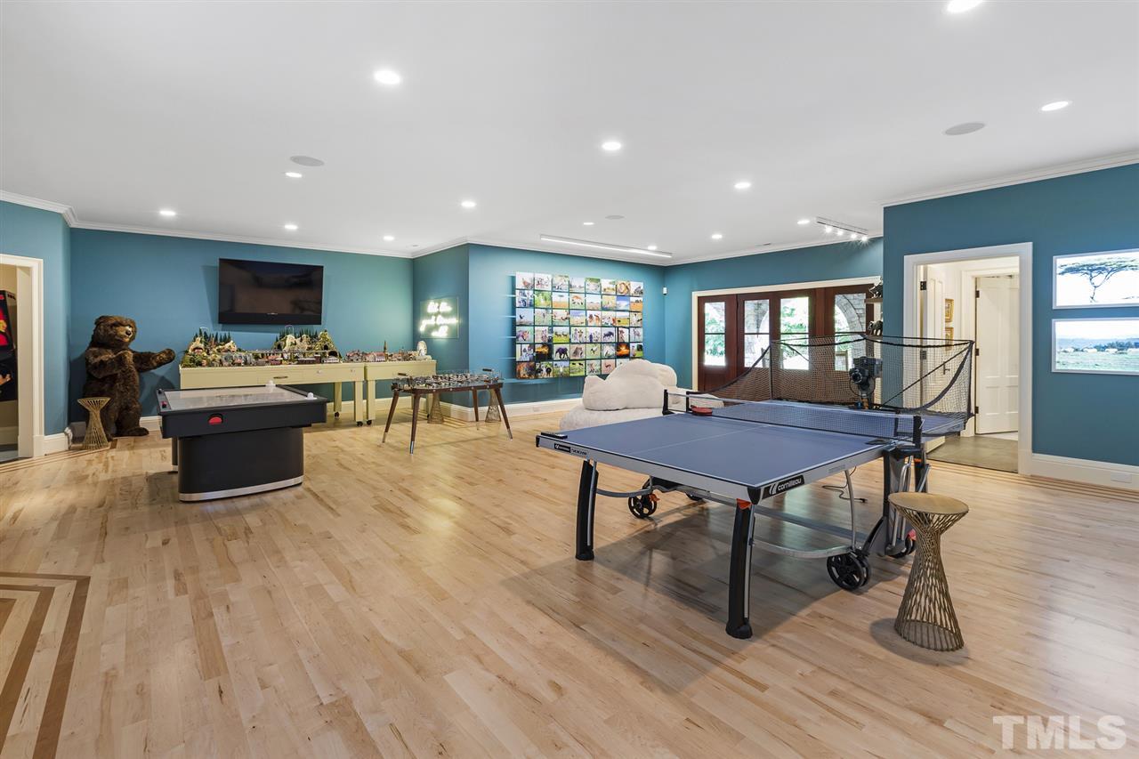 483 Rosemont Drive Durham, NC 27713 - Photo 21 of 88 a living room with lots of furniture a table and kitchen view