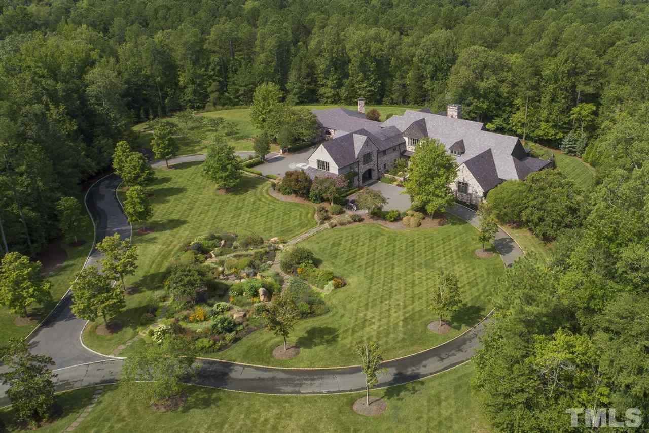 483 Rosemont Drive Durham, NC 27713 - Photo 27 of 88 a view of a garden with a fountain