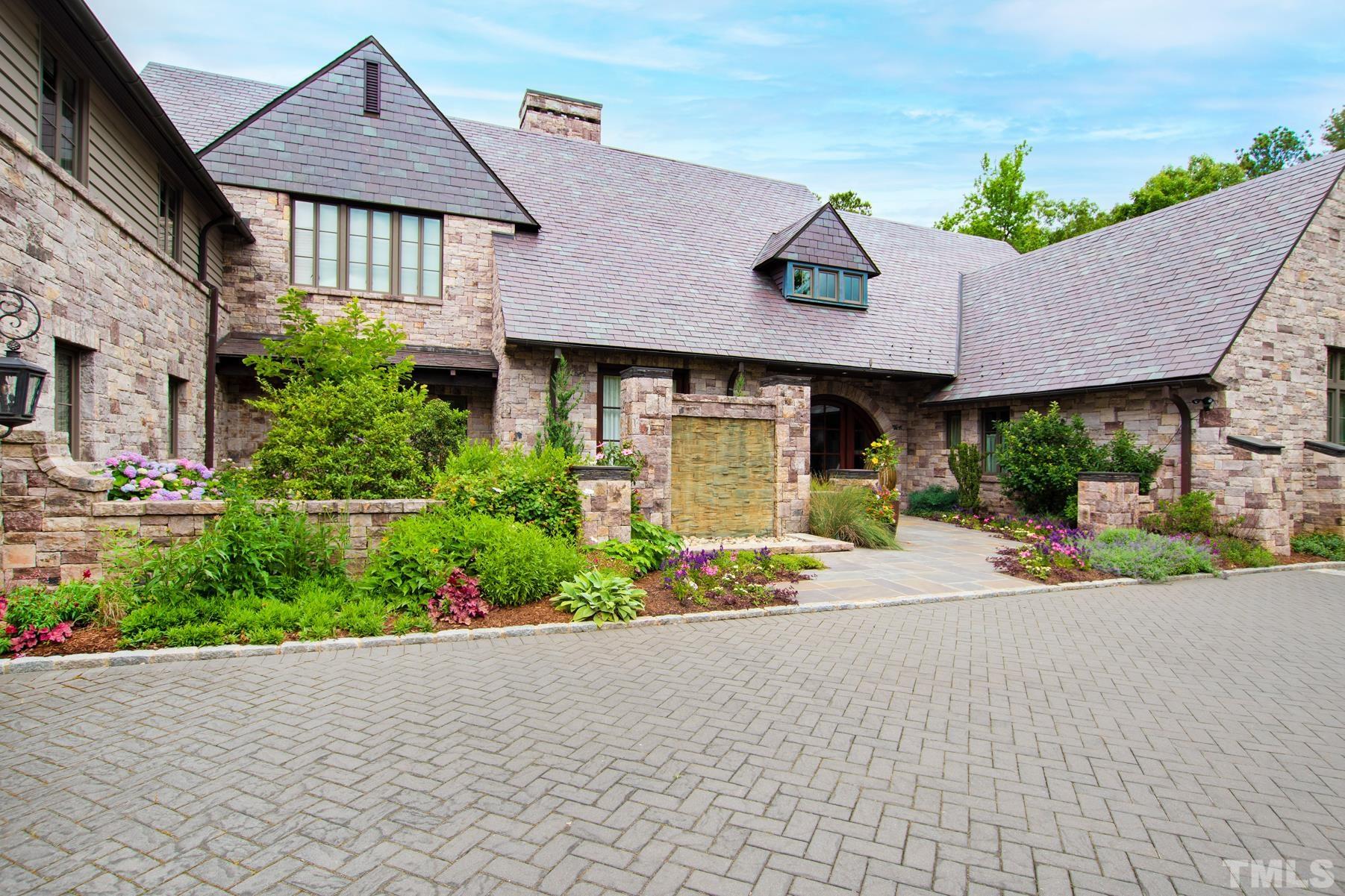 483 Rosemont Drive Durham, NC 27713 - Photo 37 of 88 a front view of a house with a yard and potted plants