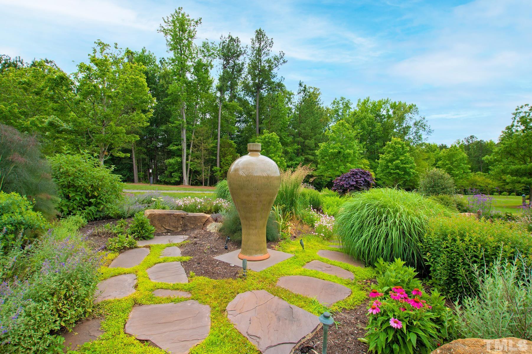 483 Rosemont Drive Durham, NC 27713 - Photo 44 of 88 a view of a table and chairs in the backyard