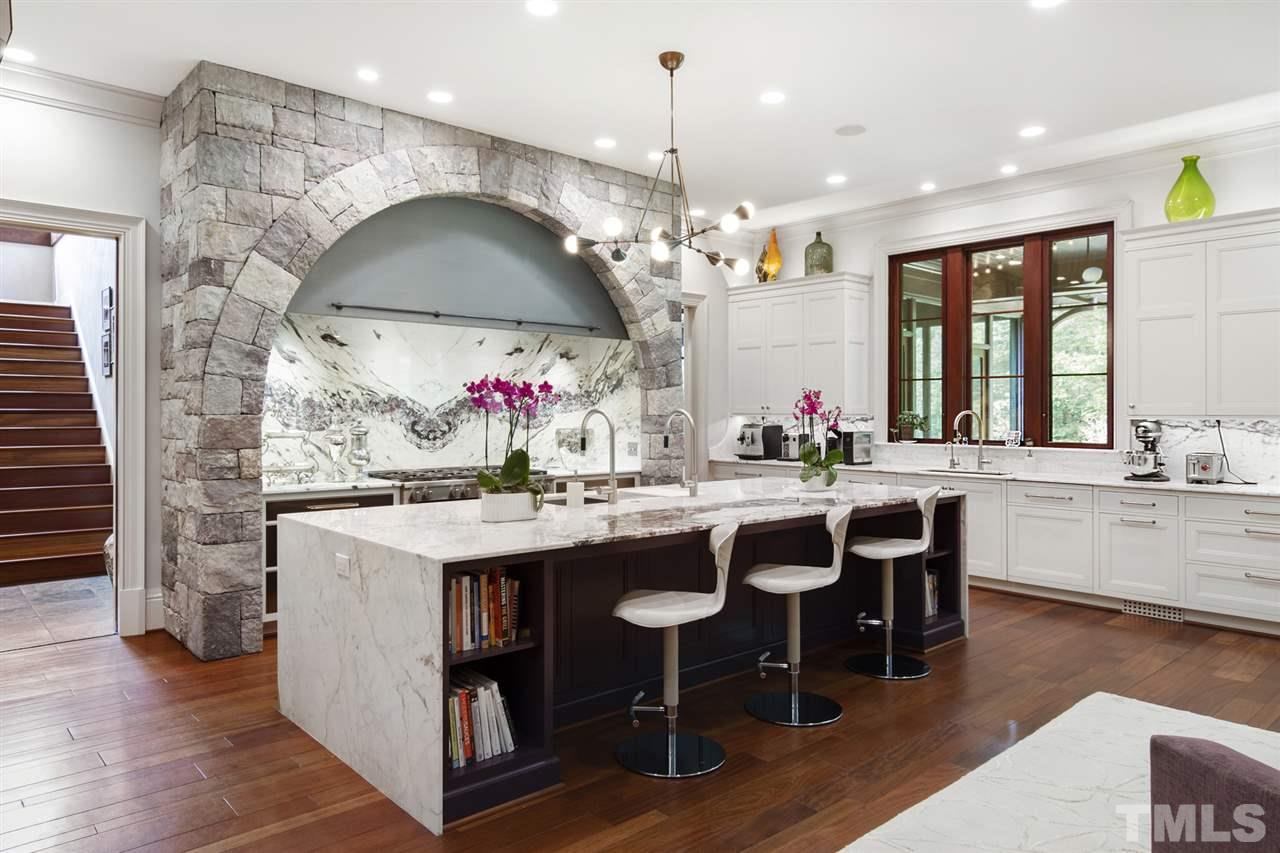483 Rosemont Drive Durham, NC 27713 - Photo 6 of 88 a kitchen with a sink and chairs