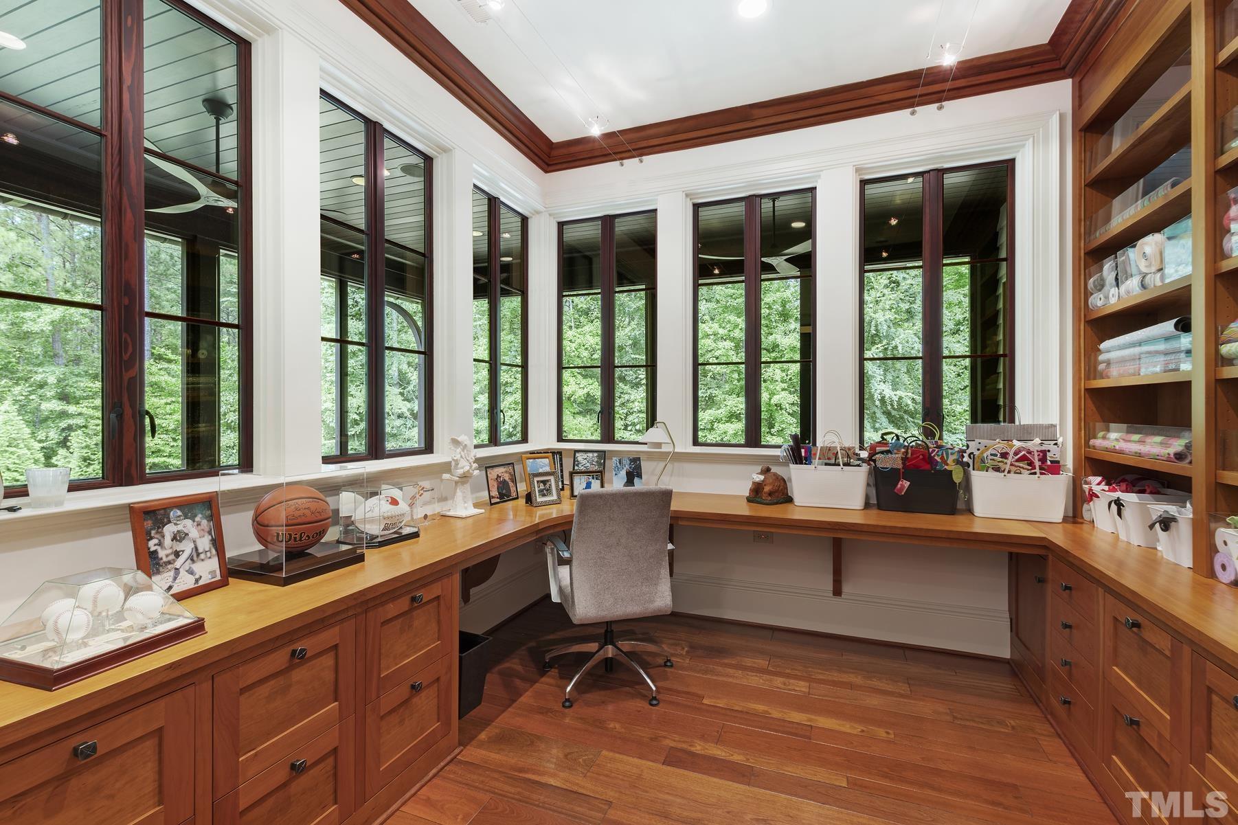 483 Rosemont Drive Durham, NC 27713 - Photo 57 of 88 a room with stainless steel appliances kitchen island granite countertop a sink and a large window