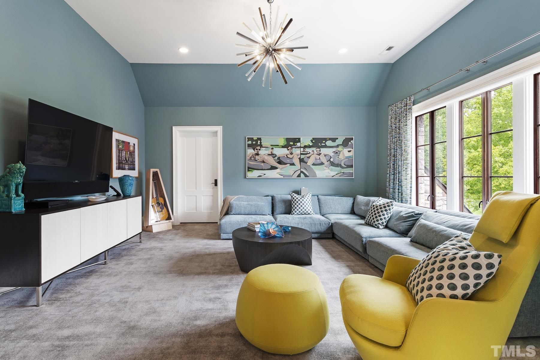 483 Rosemont Drive Durham, NC 27713 - Photo 59 of 88 a living room with furniture and a flat screen tv