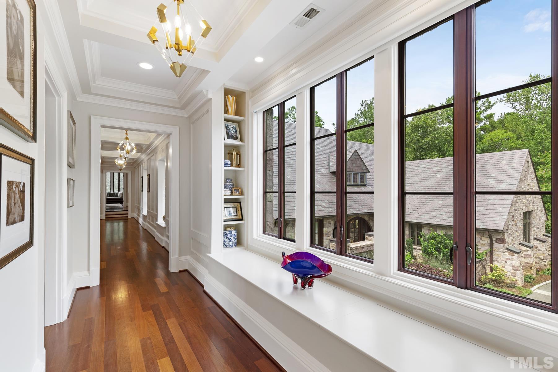 483 Rosemont Drive Durham, NC 27713 - Photo 61 of 88 a view of a living room with a floor to ceiling window and wooden floor