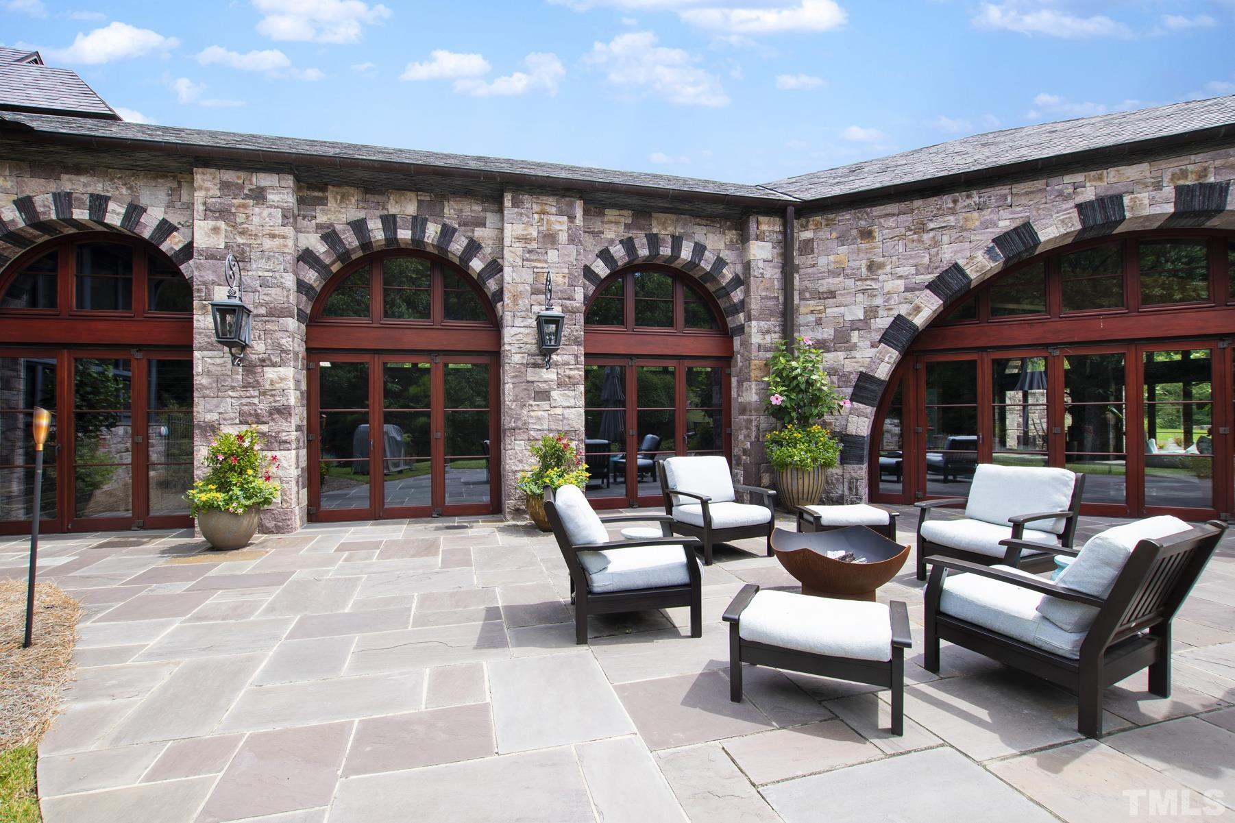 483 Rosemont Drive Durham, NC 27713 - Photo 80 of 88 a view of a patio with a table and chairs under an umbrella