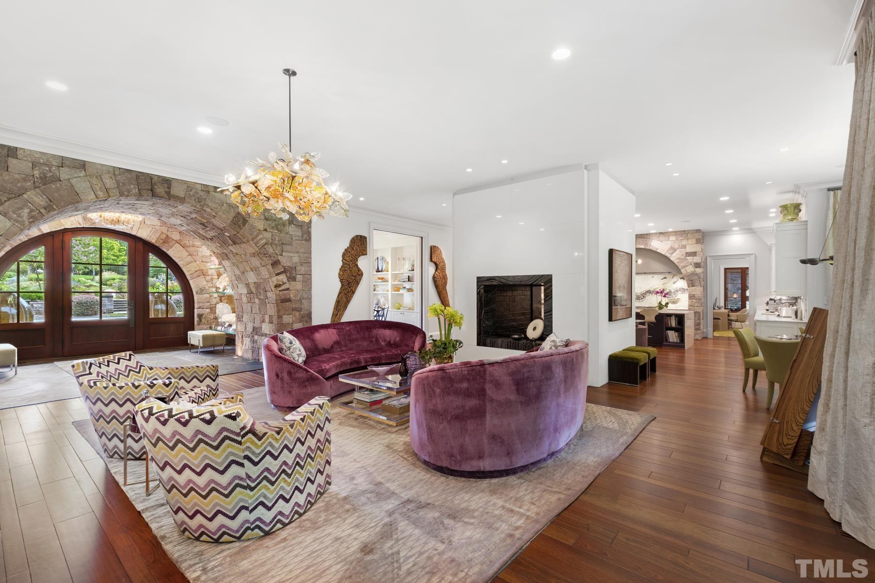 483 Rosemont Drive Durham, NC 27713 - Photo 88 of 88 a living room with furniture a chandelier and a fireplace