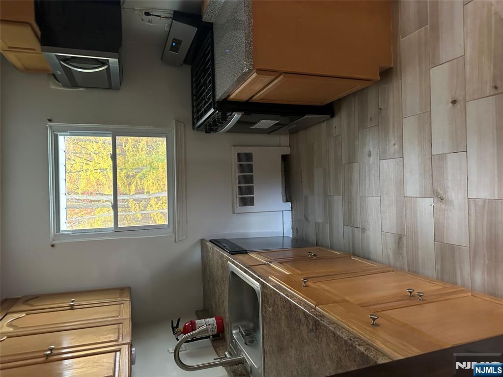 743 Newcomb Road Ridgewood, NJ 07450 - Photo 4 of 16 a kitchen that has a sink and a stove