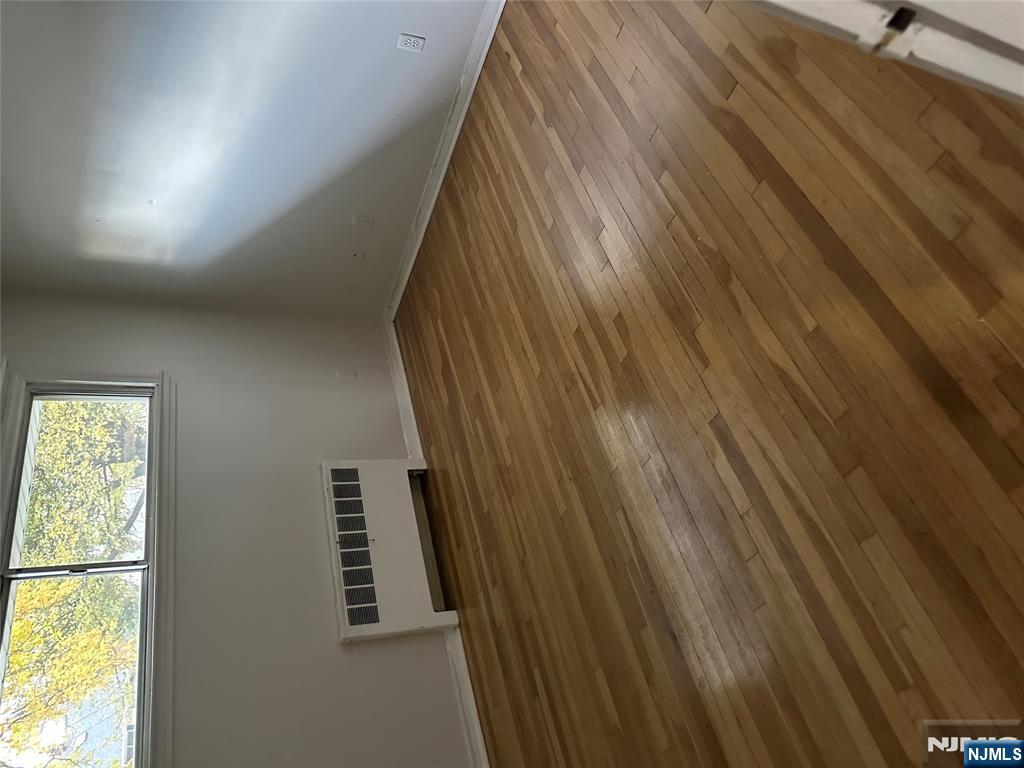 743 Newcomb Road Ridgewood, NJ 07450 - Photo 6 of 16 an empty room with wooden floor